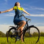 Woman on Bike in Field